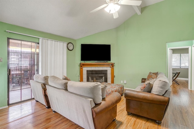 10125 Leatherwood Dr, Fort Worth, TX 76108 - living area with wood finished floors, ceiling fan, vaulted ceiling with beams, and plenty of natural light