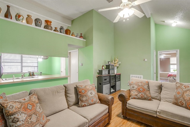 10125 Leatherwood Dr, Fort Worth, TX 76108 - living room featuring high vaulted ceiling, visible vents, a ceiling fan, and wood finished floors