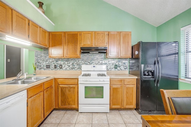 10125 Leatherwood Dr, Fort Worth, TX 76108 - kitchen with white appliances, light countertops, a sink, lofted ceiling, and extractor fan