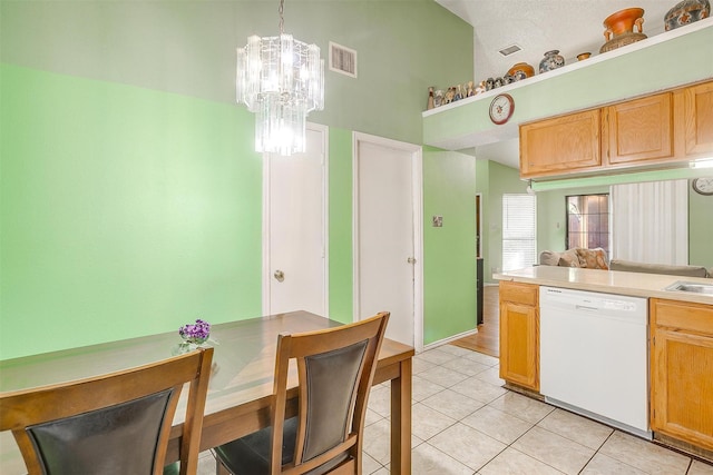 10125 Leatherwood Dr, Fort Worth, TX 76108 - kitchen with an inviting chandelier, light tile patterned floors, visible vents, high vaulted ceiling, and dishwasher