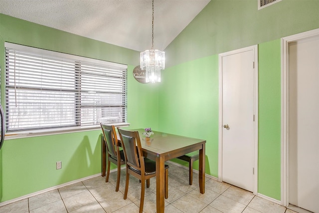 10125 Leatherwood Dr, Fort Worth, TX 76108 - dining area with light tile patterned floors, baseboards, a chandelier, and lofted ceiling