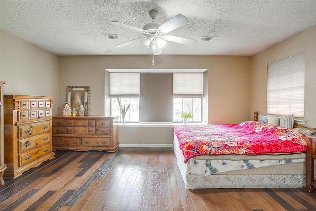 10125 Leatherwood Dr, Fort Worth, TX 76108 - bedroom featuring a textured ceiling, a ceiling fan, visible vents, and hardwood / wood-style flooring