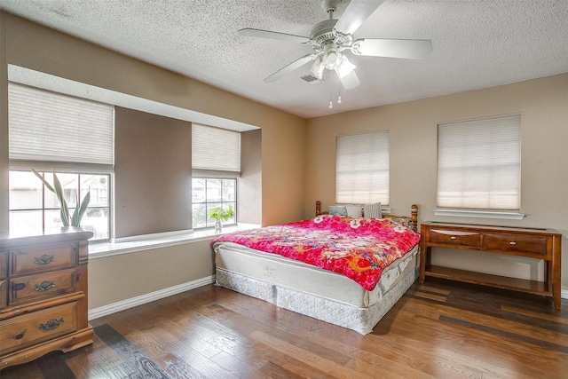 10125 Leatherwood Dr, Fort Worth, TX 76108 - bedroom with visible vents, baseboards, a ceiling fan, a textured ceiling, and wood finished floors