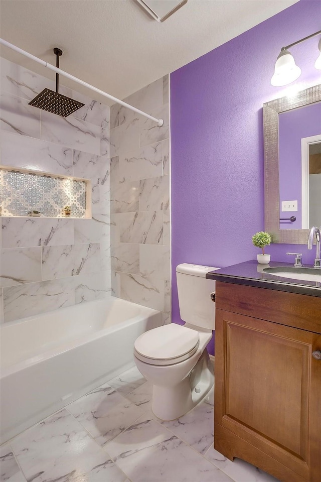 10125 Leatherwood Dr, Fort Worth, TX 76108 - full bathroom featuring vanity, toilet, marble finish floor, a textured wall, and a combined bath / shower with rainfall shower