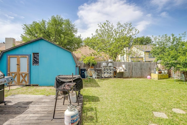 10125 Leatherwood Dr, Fort Worth, TX 76108 - view of yard featuring an outdoor structure, fence, a wooden deck, and a storage unit
