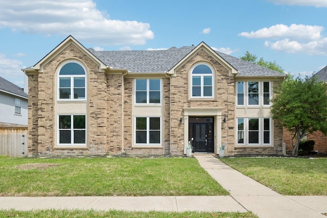 7812 Alderwood Pl, Plano, TX 75025 - traditional-style house with a front lawn, a shingled roof, and brick siding