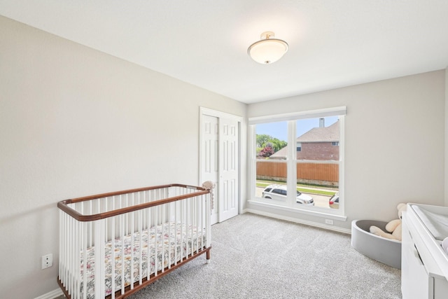 7812 Alderwood Pl, Plano, TX 75025 - carpeted bedroom featuring baseboards, a closet, and a crib