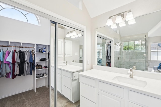 7812 Alderwood Pl, Plano, TX 75025 - full bathroom with a stall shower, lofted ceiling, plenty of natural light, two vanities, and a walk in closet