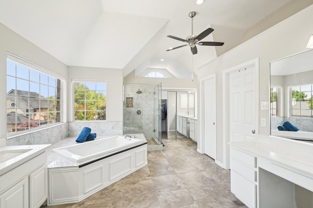 bathroom with a stall shower, a ceiling fan, lofted ceiling, and plenty of natural light