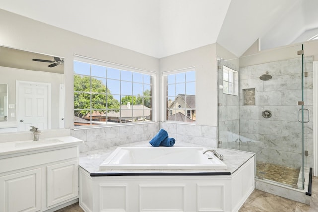 bathroom with a healthy amount of sunlight, a garden tub, and a stall shower