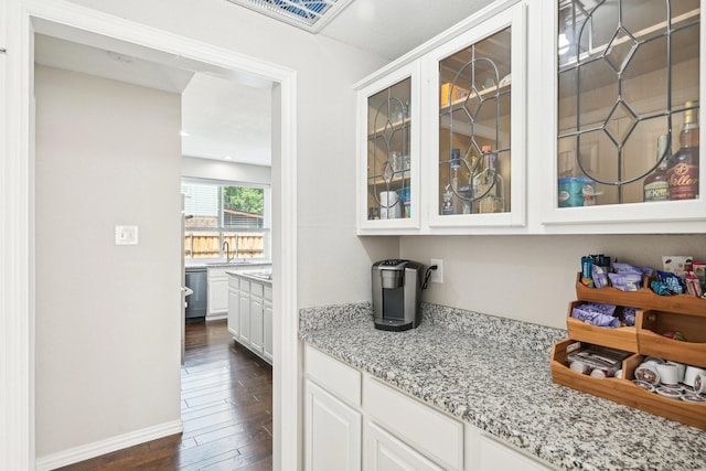 7812 Alderwood Pl, Plano, TX 75025 - bar featuring a sink, dark wood finished floors, stainless steel dishwasher, and baseboards