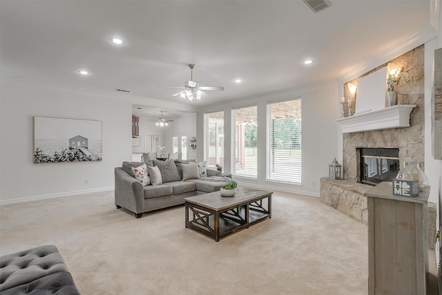 living area with ceiling fan, light carpet, crown molding, and baseboards