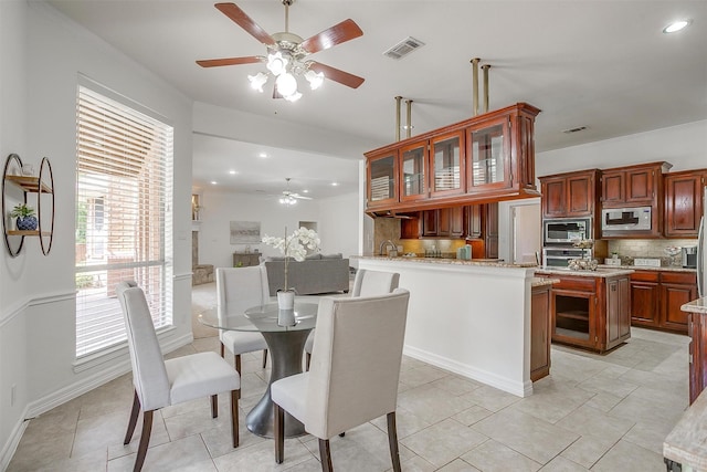 dining space featuring ceiling fan, crown molding, visible vents, and recessed lighting