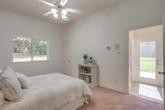 bedroom featuring multiple windows, ornamental molding, baseboards, and light carpet