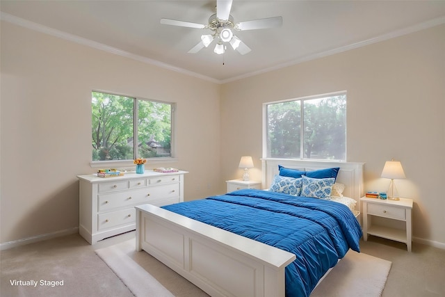 bedroom featuring light carpet, multiple windows, and baseboards