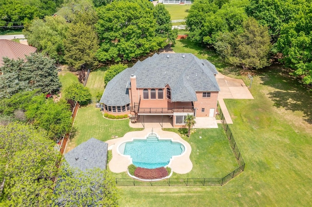 exterior space featuring a fenced backyard, a fenced in pool, a yard, and a patio