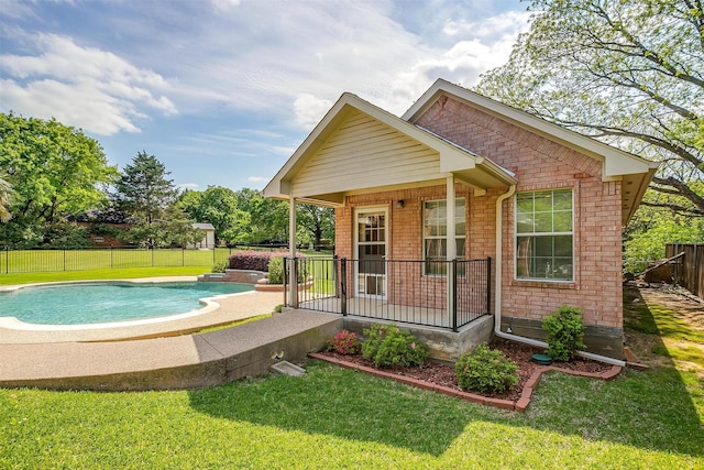 exterior space featuring a fenced backyard, a porch, a yard, and a fenced in pool