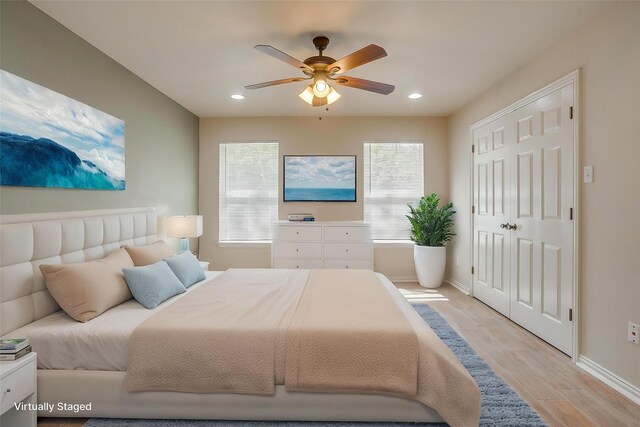 bedroom with recessed lighting, baseboards, a ceiling fan, and light wood-style flooring