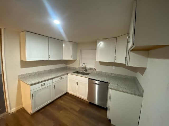kitchen featuring a sink, white cabinets, dishwasher, and dark wood-style floors