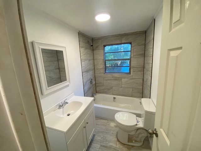 bathroom with toilet, vanity, marble finish floor, and washtub / shower combination