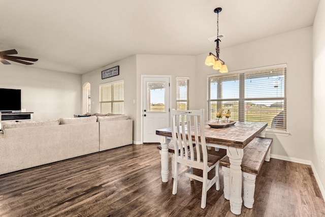dining room with dark wood-style floors, baseboards, and a ceiling fan