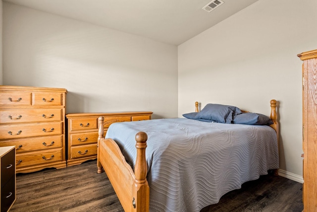 bedroom featuring baseboards, dark wood-style floors, and visible vents
