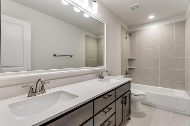 full bathroom with a sink, visible vents, toilet, and tile patterned floors