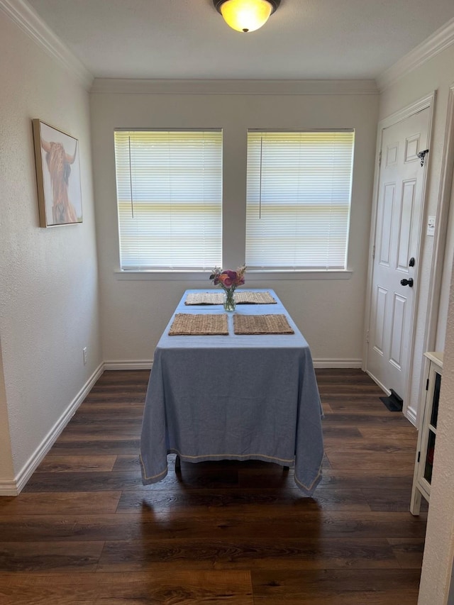 dining area with dark wood-style floors, crown molding, and a healthy amount of sunlight