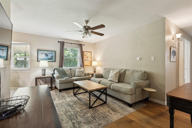 1202 Johns Dr, Euless, TX 76039 - living area featuring a ceiling fan, wood finished floors, and baseboards
