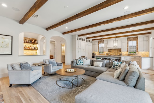 6622 Blue Valley Ln, Dallas, TX 75214 - living area with light wood-style flooring, arched walkways, visible vents, and recessed lighting