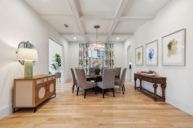 6622 Blue Valley Ln, Dallas, TX 75214 - dining space featuring light wood-style flooring, arched walkways, beamed ceiling, and coffered ceiling