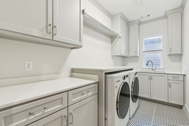 6622 Blue Valley Ln, Dallas, TX 75214 - washroom featuring visible vents, washer and dryer, a sink, cabinet space, and light floors