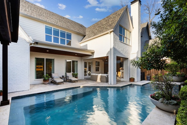 6622 Blue Valley Ln, Dallas, TX 75214 - back of house with a fenced in pool, a patio, a chimney, an outdoor living space, and fence