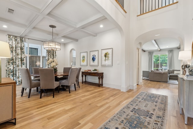 6622 Blue Valley Ln, Dallas, TX 75214 - dining room with visible vents, baseboards, arched walkways, and wood finished floors