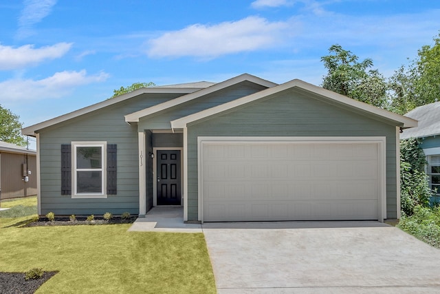 ranch-style home with concrete driveway, a garage, and a front lawn