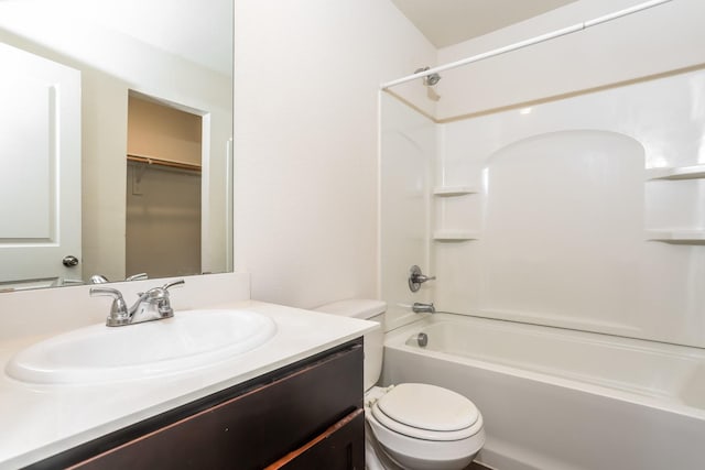 bathroom with toilet, tub / shower combination, and vanity