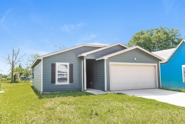single story home featuring a front yard, driveway, and an attached garage