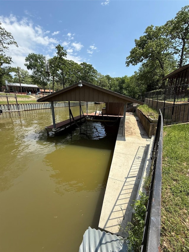 view of dock featuring a water view and boat lift