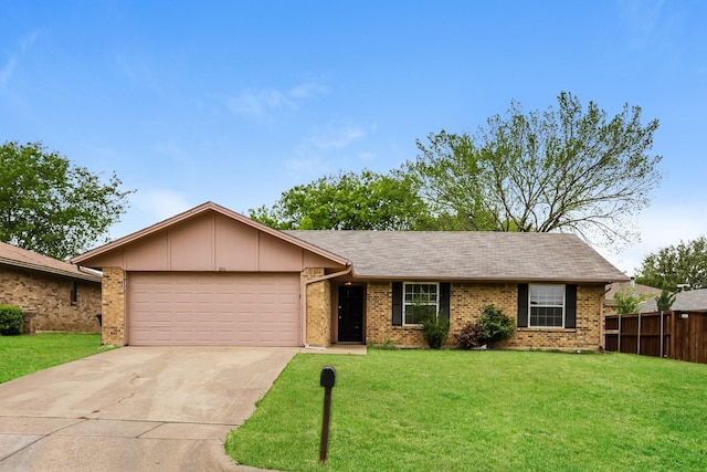 ranch-style house with a garage, fence, a front lawn, brick siding, and driveway