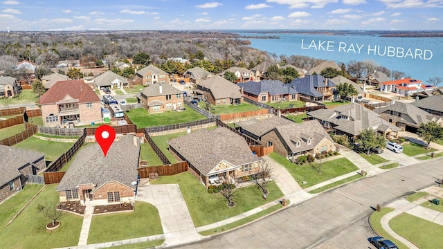 1806 Enchanted Cv, Wylie, TX 75098 - view of front of house featuring a shingled roof, stone siding, a front lawn, and brick siding