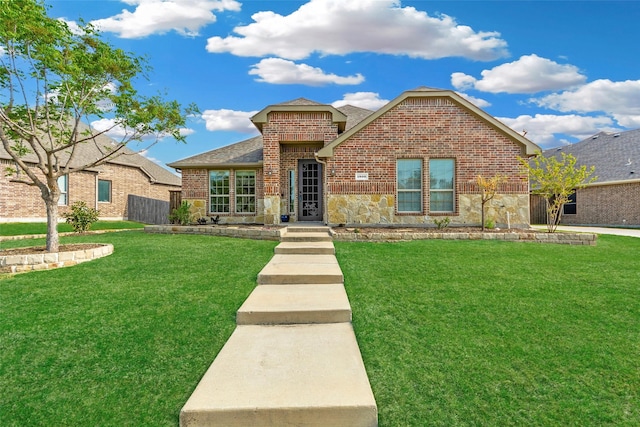 1806 Enchanted Cv, Wylie, TX 75098 - back of property featuring a fenced backyard, a yard, a patio area, and brick siding