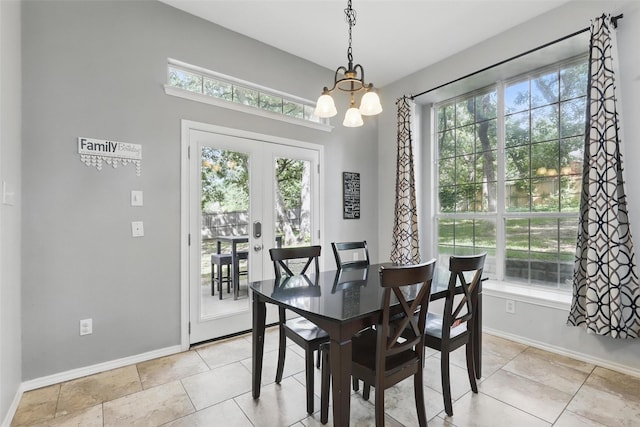 805 Red Oak Ct, Crowley, TX 76036 - dining space featuring french doors, baseboards, healthy amount of natural light, and a chandelier