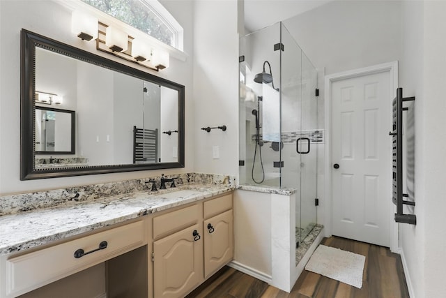 805 Red Oak Ct, Crowley, TX 76036 - bathroom featuring a stall shower, wood finished floors, vanity, and a towel warmer