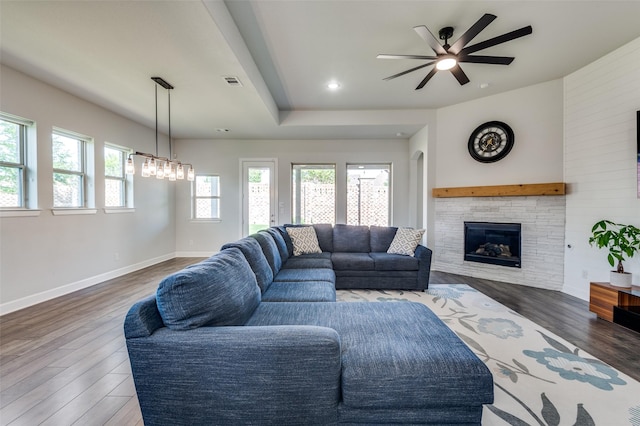 3128 Lexington Dr, Celina, TX 75009 - living area featuring ceiling fan, wood finished floors, and a stone fireplace
