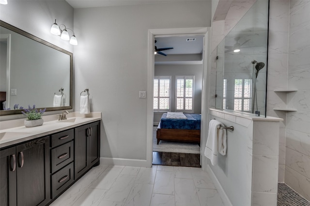 3128 Lexington Dr, Celina, TX 75009 - ensuite bathroom with marble finish flooring, double vanity, a walk in shower, and a ceiling fan