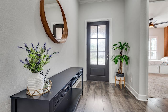 3128 Lexington Dr, Celina, TX 75009 - foyer entrance with dark wood-style floors, a ceiling fan, and a textured wall