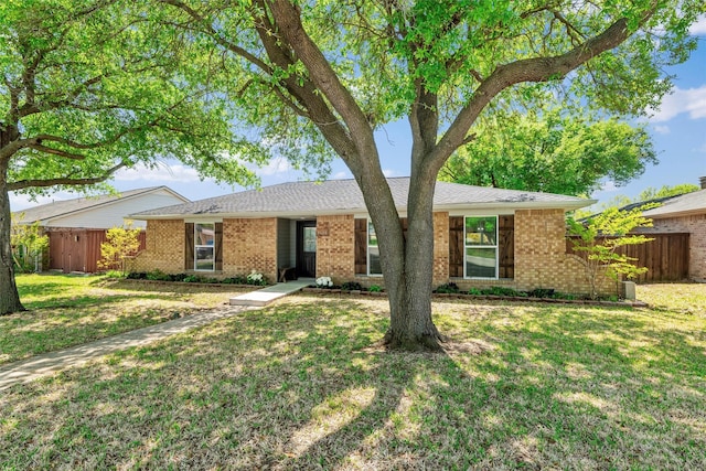 3638 Parkmont St, Mesquite, TX 75150 - ranch-style house with fence, brick siding, and a front yard
