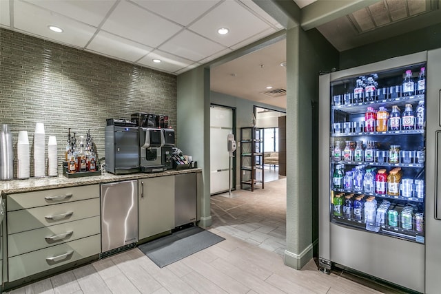 330 Las Colinas Blvd E Unit 364, Irving, TX 75039 - bar area with freestanding refrigerator, refrigerator, light wood finished floors, and recessed lighting