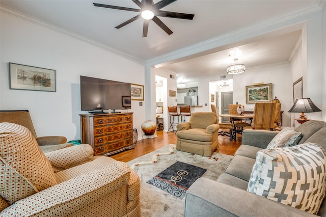 330 Las Colinas Blvd E Unit 364, Irving, TX 75039 - living room featuring a ceiling fan, ornamental molding, wood finished floors, and a chandelier