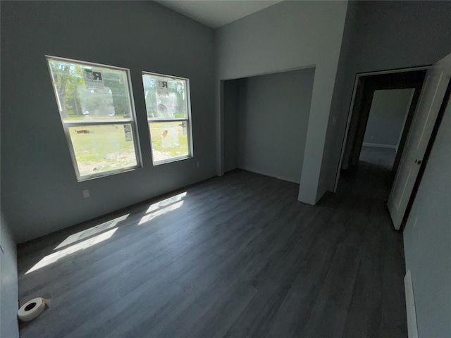 409 S Main St, Bonham, TX 75418 - unfurnished bedroom with wood finished floors and a closet